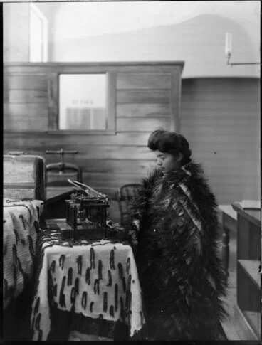 Image: Maori girl with a typewriter