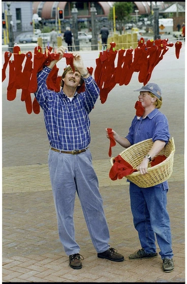 Image: Sir Peter Blake and Philip Jameson hanging red socks on a clothes line - Photograph taken by Ross Giblin