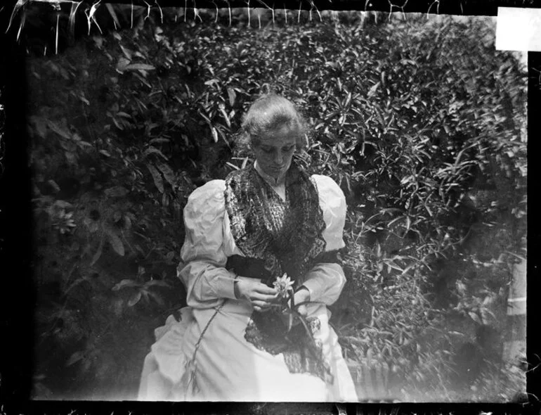 Image: Woman holding flower