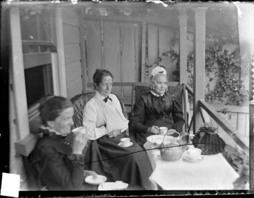 Image: Amy Kirk, Sarah Jane Kirk, and another woman taking tea on a verandah