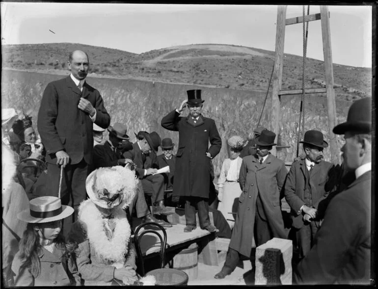 Image: Official making a speech in a field