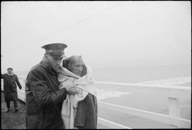 Image: Survivor from Wahine shipwreck with Salvation Army Cadet Keith Goodisson on wharf in Seatoun, Wellington