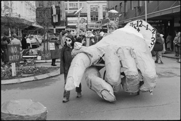 Image: Demonstrators with a large papier-mache hand at an antinuclear demonstration, Wellington - Photograph taken by Stuart Ramson