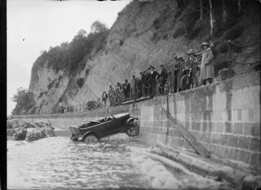 Image: Car being hauled out of the sea after an accident