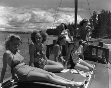 Image: Women in swimsuits on the launch Royal Saxon, Matakana Island