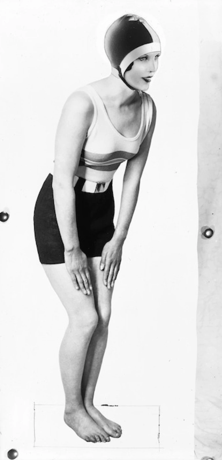 Image: Young woman modelling bathing suit and cap