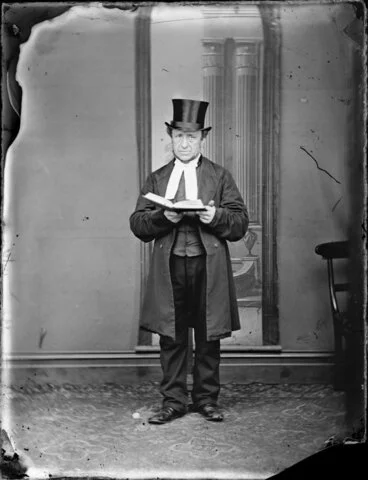 Image: Unidentified man, with an open book