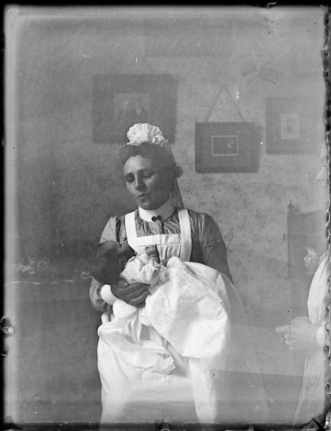 Image: Nurse holding an infant