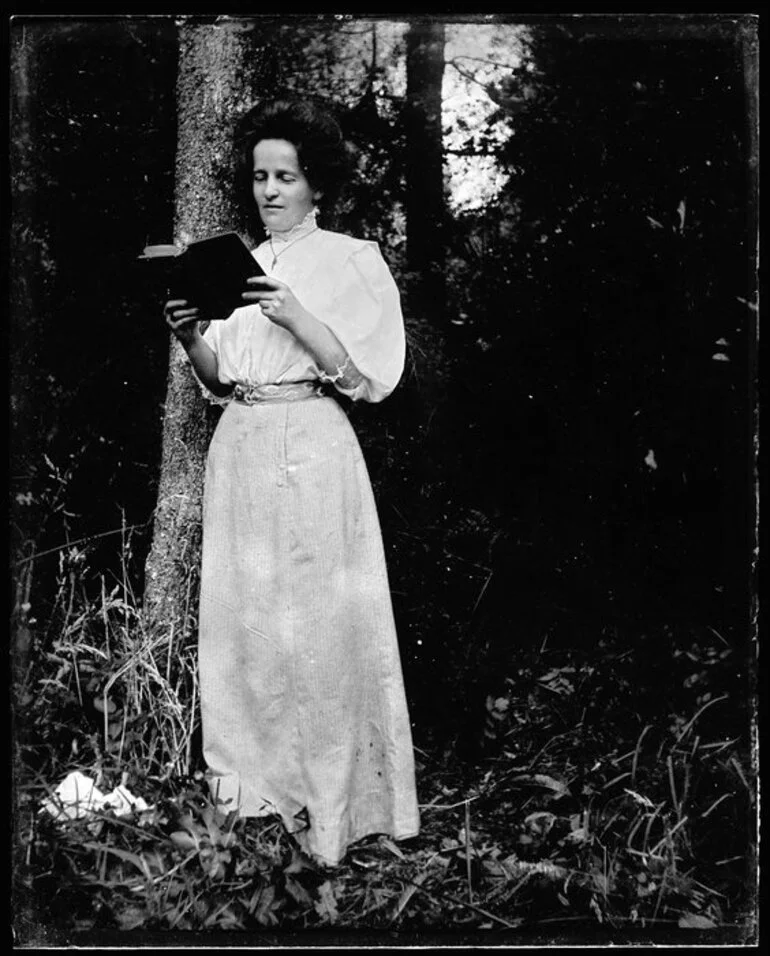 Image: Woman holding a book