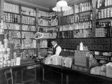 Image: Grocery shop interior with shelves full of tins and bottles