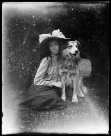 Image: Portrait of teenage girl with border collie dog