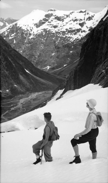 Image: A man and woman walking in snow in the Eglinton River Valley, Southland