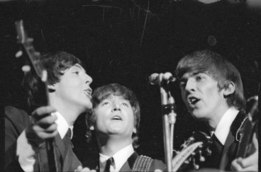 Image: Beatles Paul McCartney, John Lennon and George Harrison singing during their Wellington concert