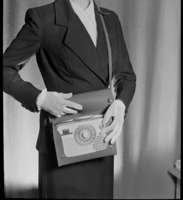 Image: Model displaying portable radio