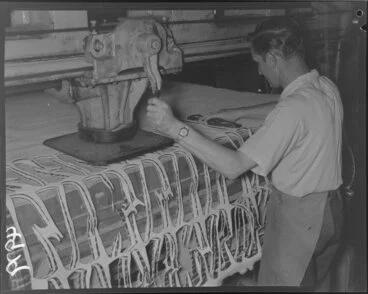 Image: Man operating sole-stamping machine at Buchanan and Edwards shoe factory