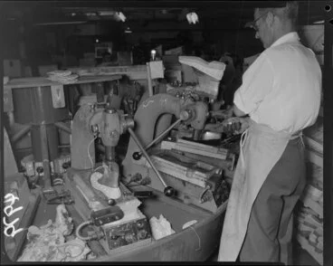 Image: Man operating machine at Buchanan and Edwards shoe factory