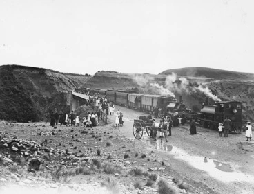 Image: Steam train stopped on the Waimakariri Gorge bridge, Canterbury, and passengers alongside