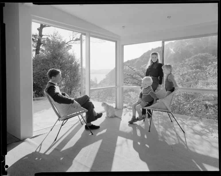 Image: Family group in living room of unidentified house