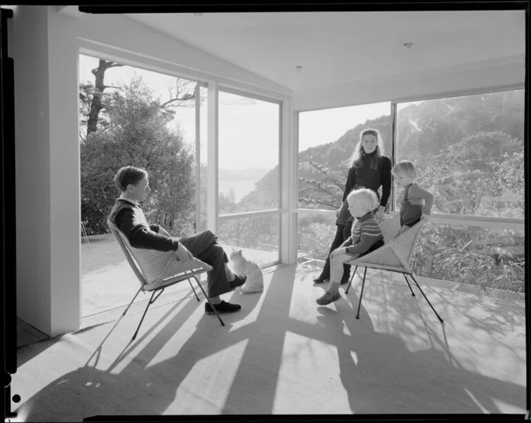 Image: Family group in living room of unidentified house