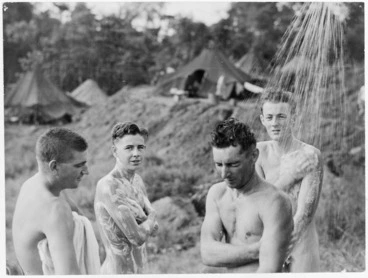 Image: Members of the Royal New Zealand Air Force, in the Pacific Islands during World War II, showering outside