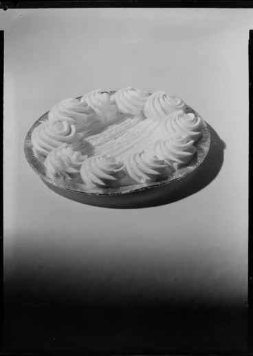 Image: A pie decorated with cream