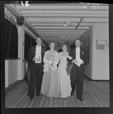 Image: Group dressed in evening finery, on passenger deck of ship Dominion Monarch, for Young Women's Christian Association Ball
