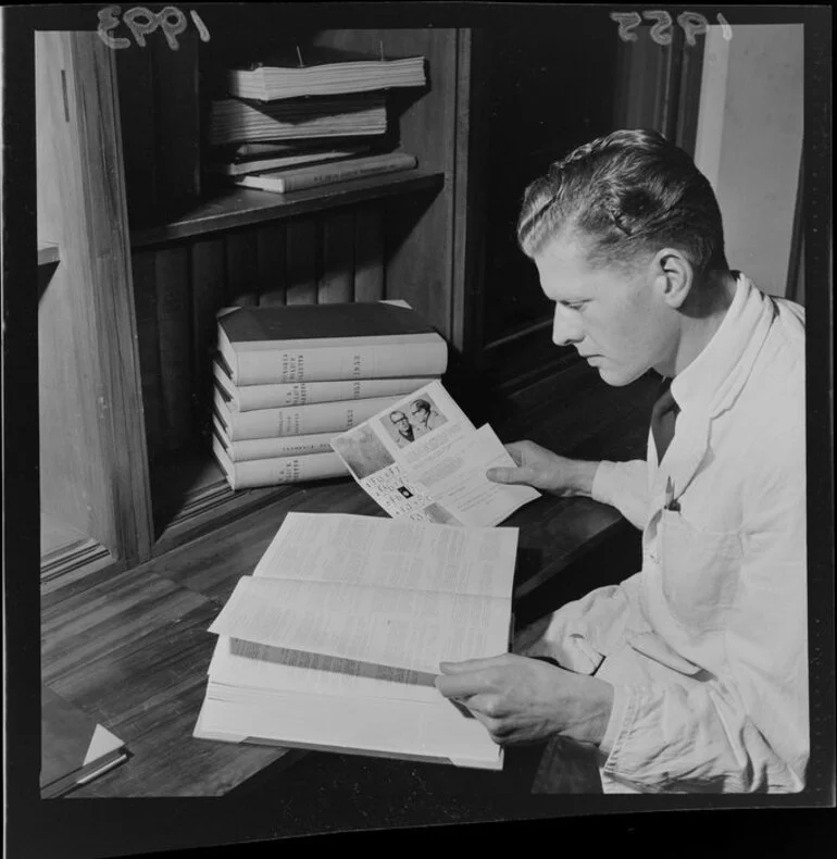 Image: Police staff member checking a publication on a police file