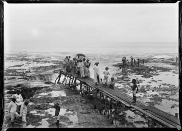 Image: Niueans waiting on a wharf at low tide, during the visit of the HMS Mildura and Lord Ranfurly