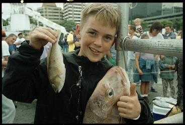 Image: 12 year old Nick Theodorou with his prize winning fish, and a large snapper caught by someone else - Photograph taken by Melanie Burford