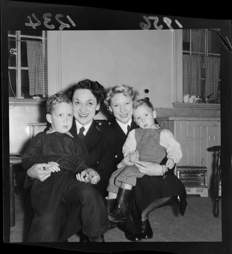 Image: Two female constables (P Mathieson and G Fullwood) with two children