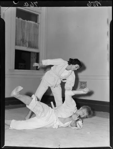 Image: Miss Carla Pagani throws Barrie Chivers during a demonstration of martial arts