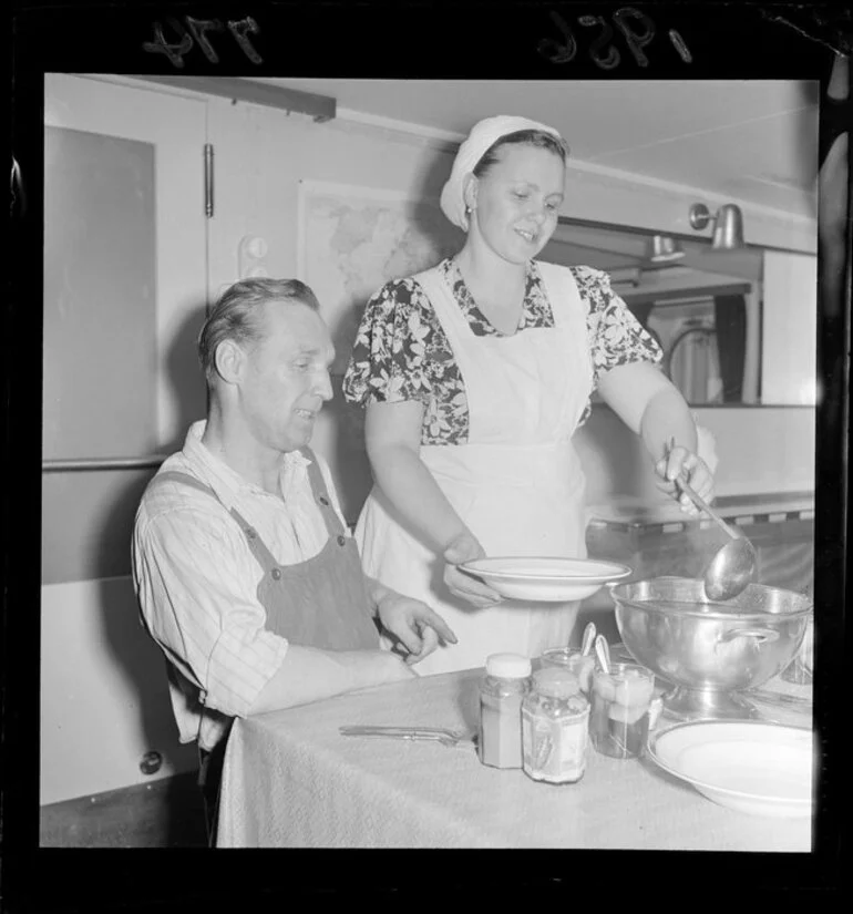 Image: Unidentified Russian woman serving soup to an unidentified man on board the Russian Antarctic Expedition's supply ship, Ob