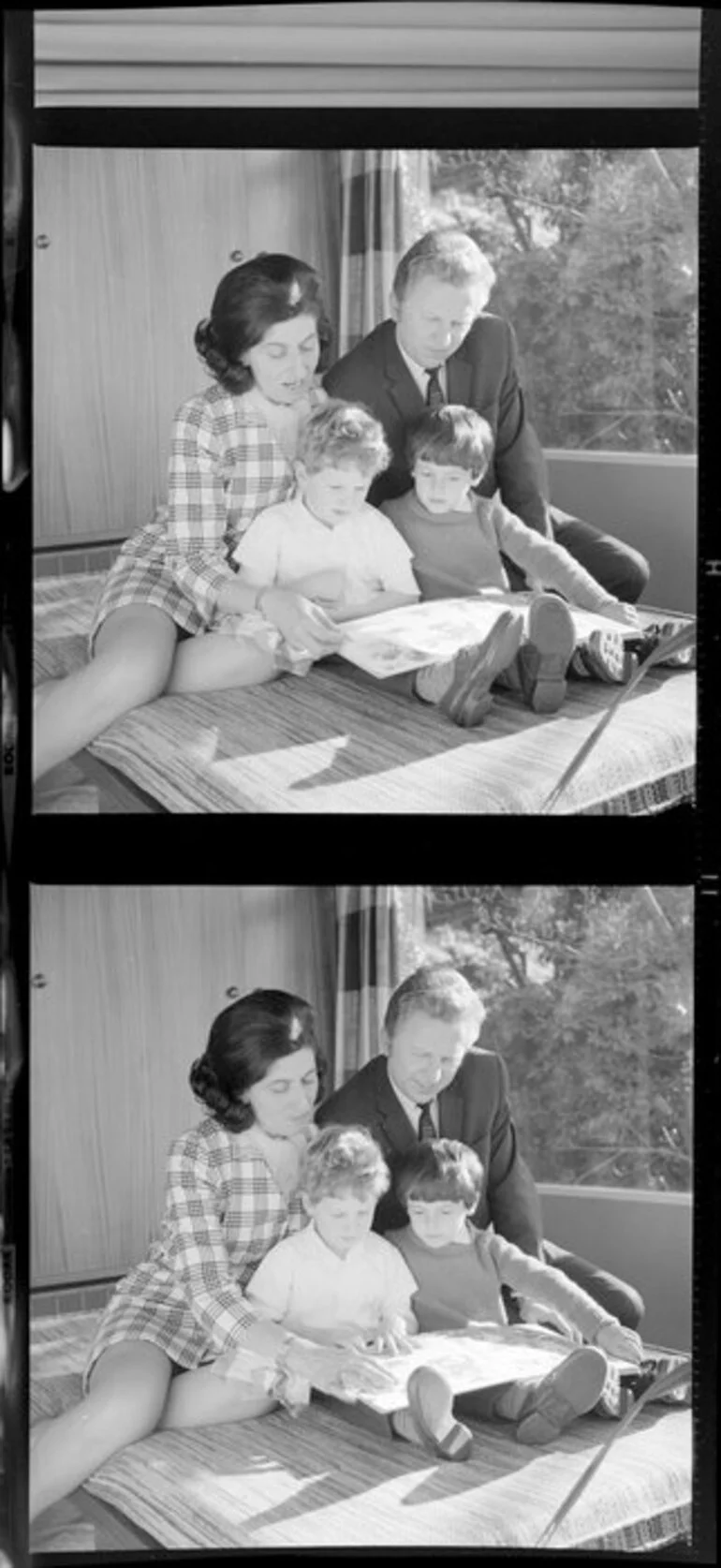 Image: The Winkler family reading a book together