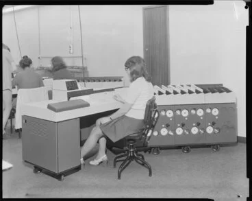 Image: Woman operating large computer