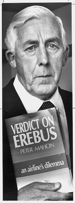 Image: Former High Court judge, and Head of the Commission of Enquiry into the Erebus disaster, Peter Mahon, with his book Verdict on Erebus - Photograph taken by Ray Pigney