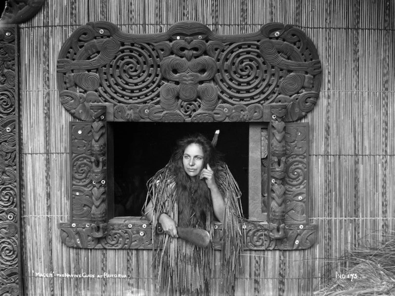 Image: Makereti Papakura at the carved window frame of Te Rauru meeting house, Whakarewarewa