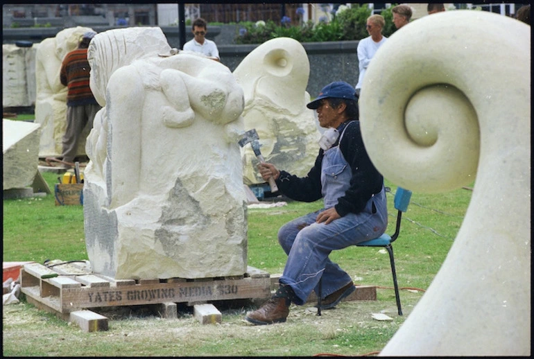 Image: Marie Moanaroa-Parata-Munroe working on a sculpture in Frank Kitts Park, Wellington - Photograph taken by Ray Pigney