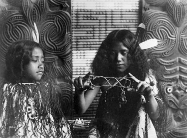 Image: Maori girls playing a string game