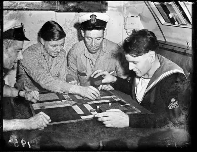 Image: Four sailors from HMS Telemachus playing ukkers (ludo), Wellington