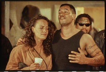 Image: Production still showing Beth and Jake Heke singing at a party