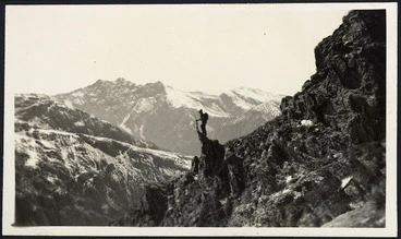 Image: Creator unknown : Photograph of mountain ridges, and a deer hunter