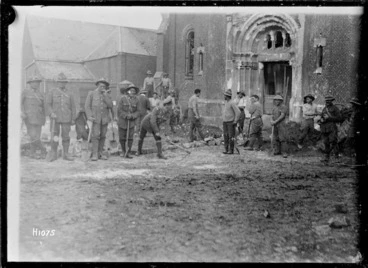 Image: New Zealand Pioneers filling in a mine crater outside a church in Beauvois, World War I