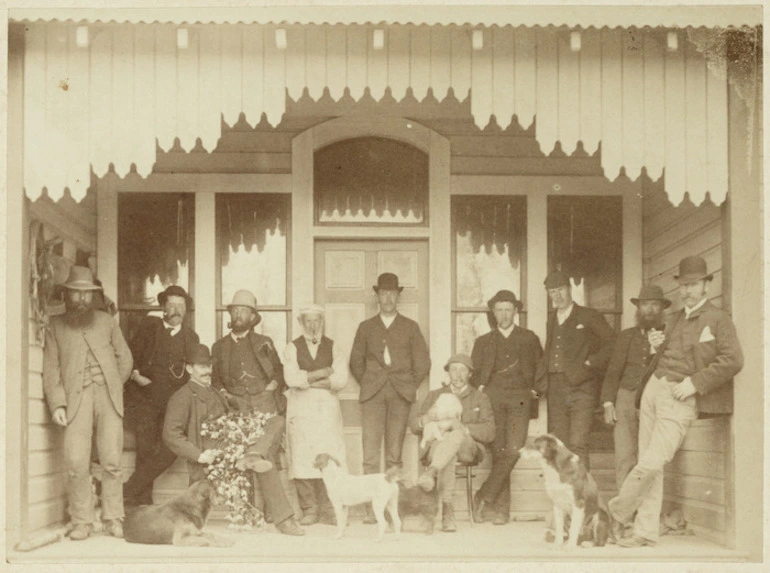 Image: Group of men and dogs on a veranda