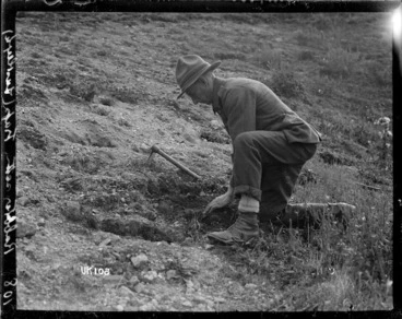Image: A rabbiter setting a trap at Lustleigh, World War I