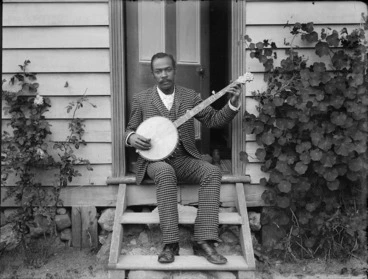 Image: Banjo player, probably Hosea Easton, at home of William and Lydia Williams, Carlyle Street, Napier