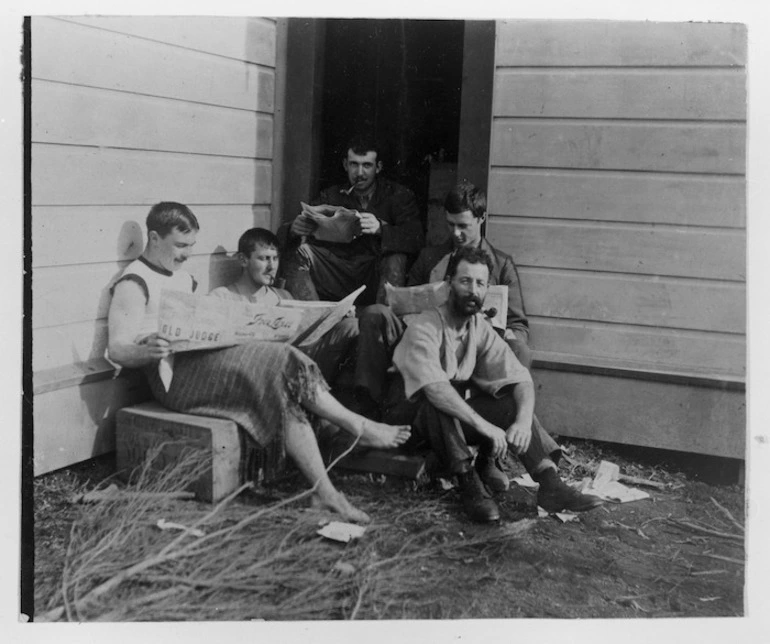 Image: Cattle musterers outside their whare during mustering season, probably Wairarapa