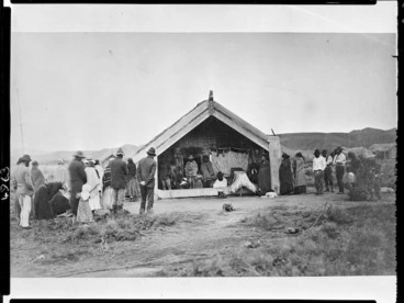 Image: Maori tangi at meeting house, (Ruatapu, West Coast?) - Photographer possibly Alfred Burton