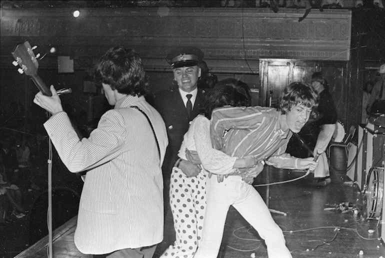 Image: Security guard restraining fan during Rolling Stones concert, Wellington Town Hall