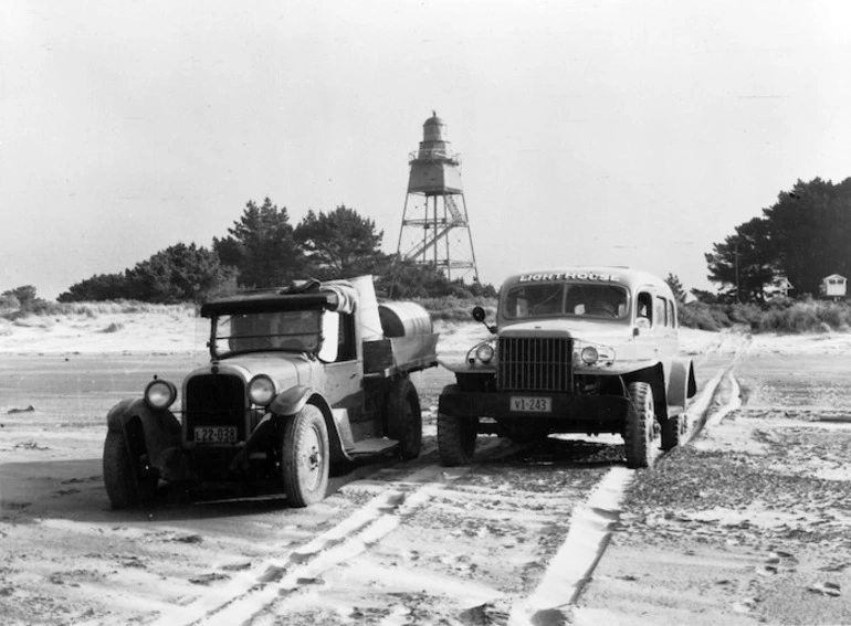 Image: Two trucks and the lighthouse, Farewell Spit