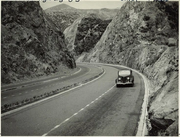 Image: Car travelling up Ngauranga Gorge, Wellington - Photograph by John Dobree Pascoe